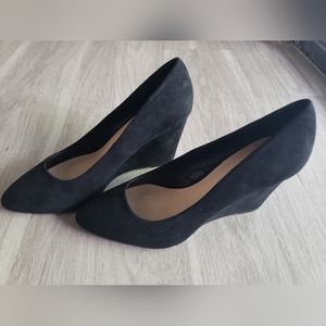 Black suede wedge pumps